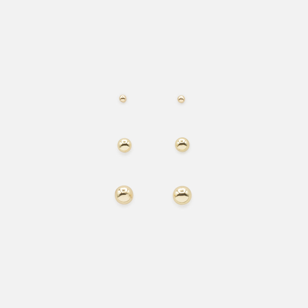 Set of three fixed golden bead earrings