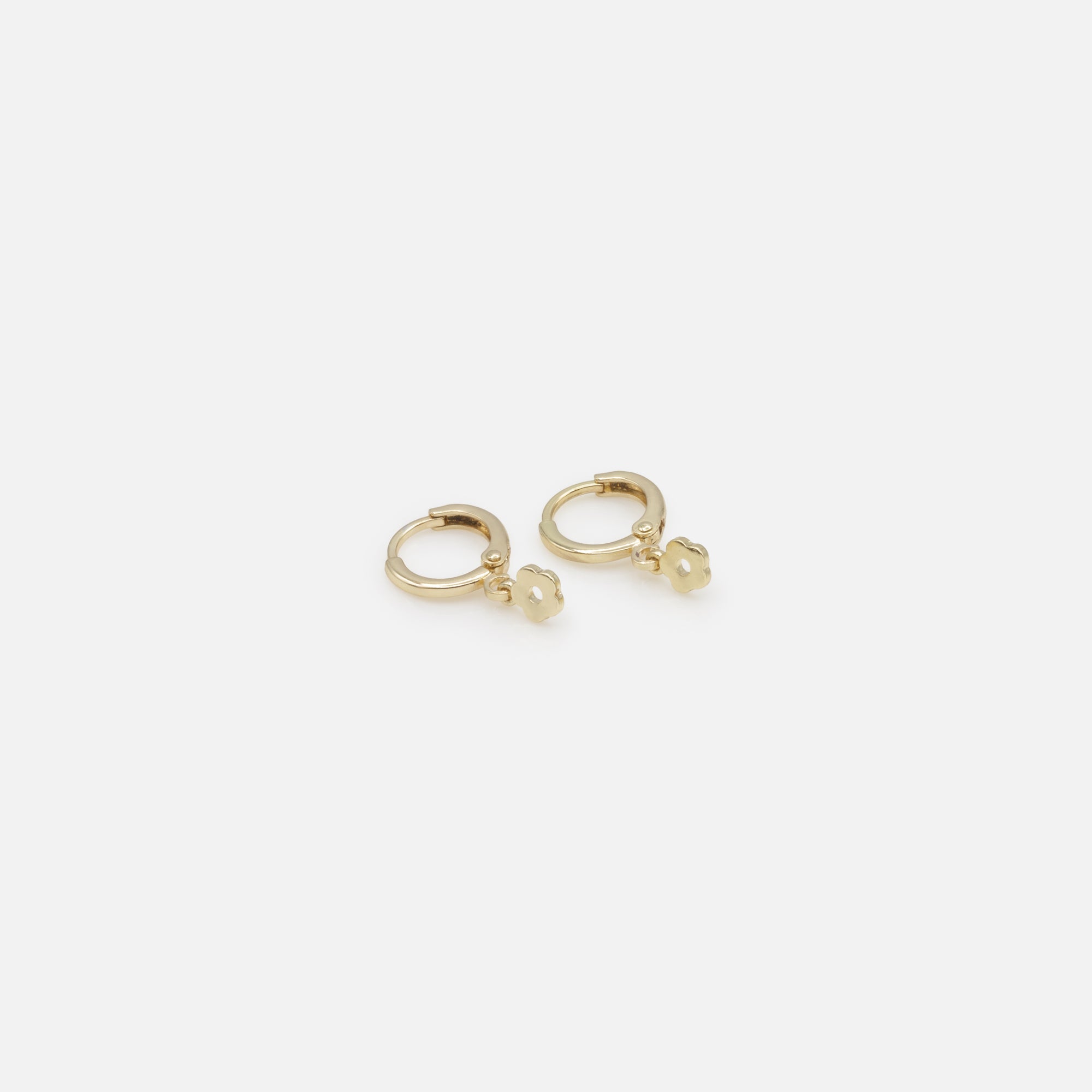 Duo of simple gold hoop earrings and flower charm