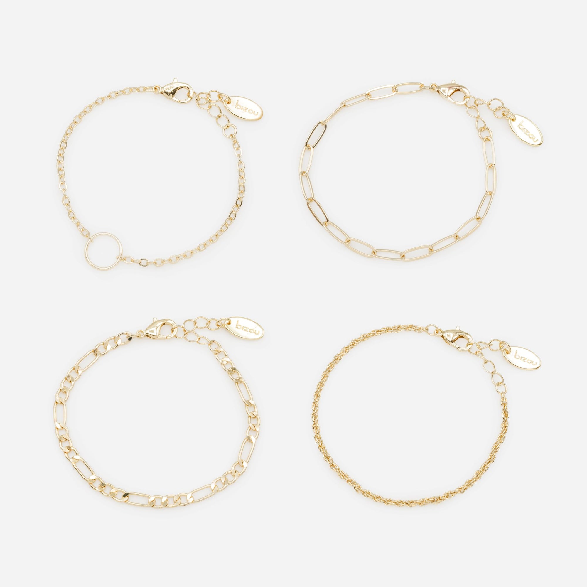 Ensemble de quatre bracelets dorés à mailles fines et variées