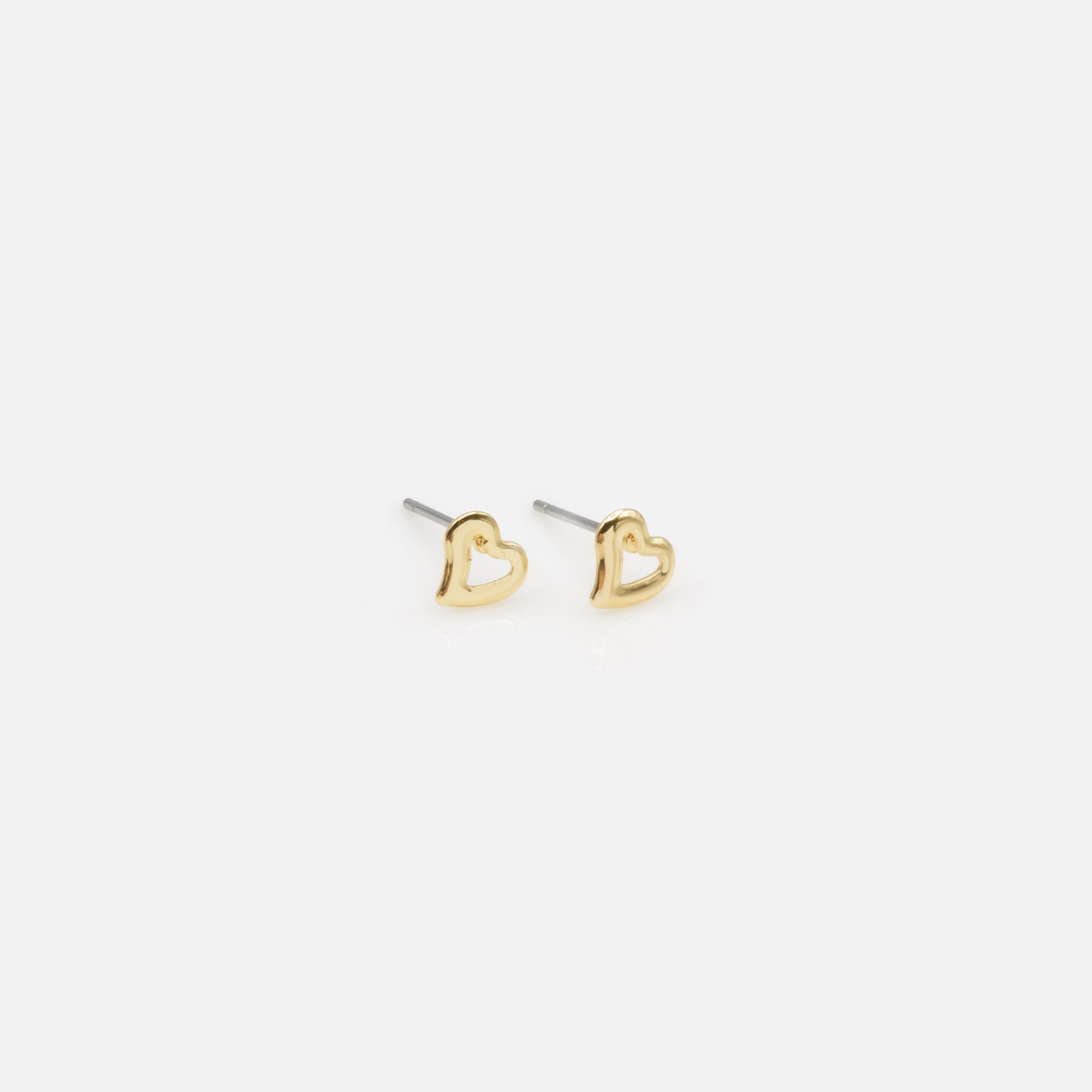 Set of three fixed golden heart and petal earrings