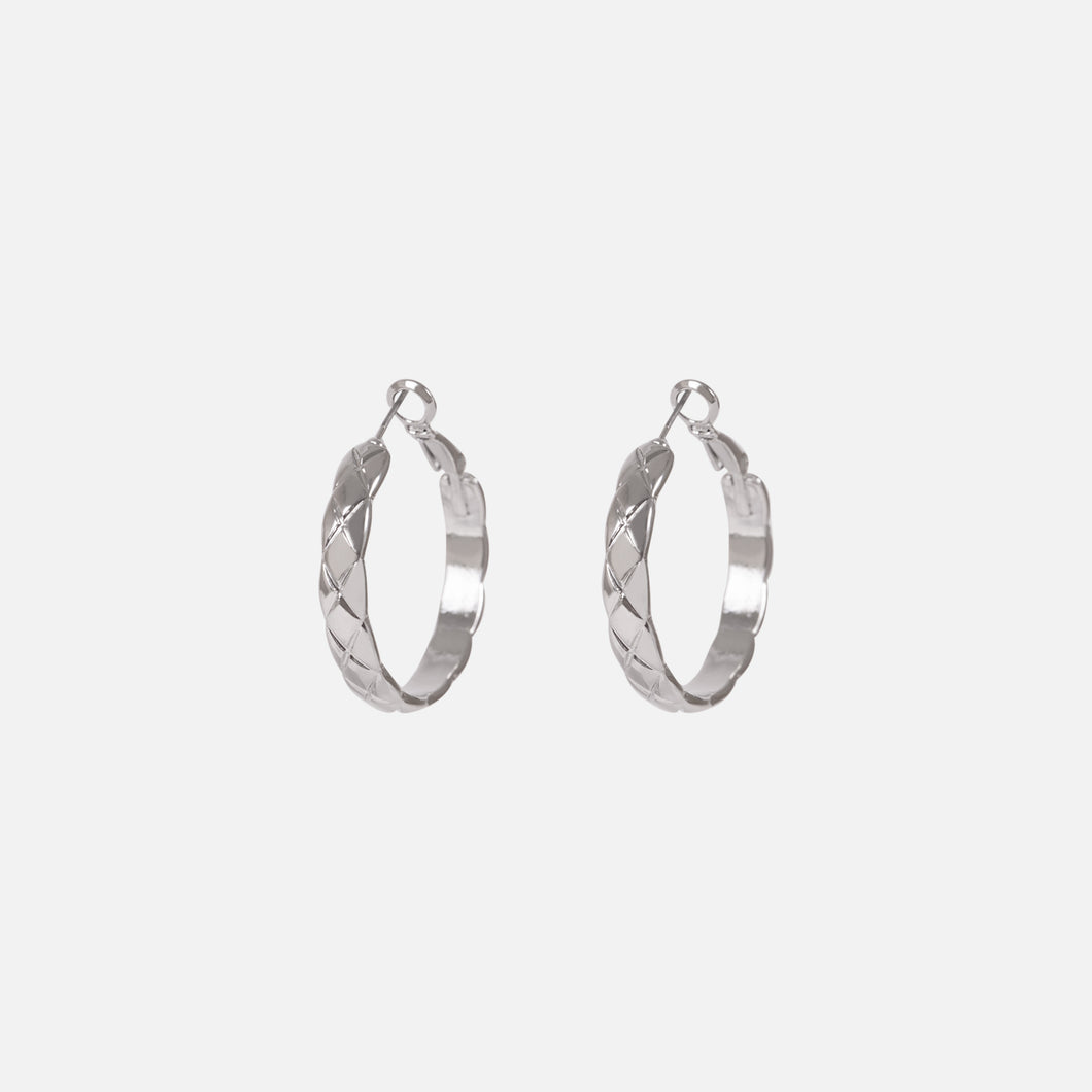 Silver hoop earrings with scale pattern