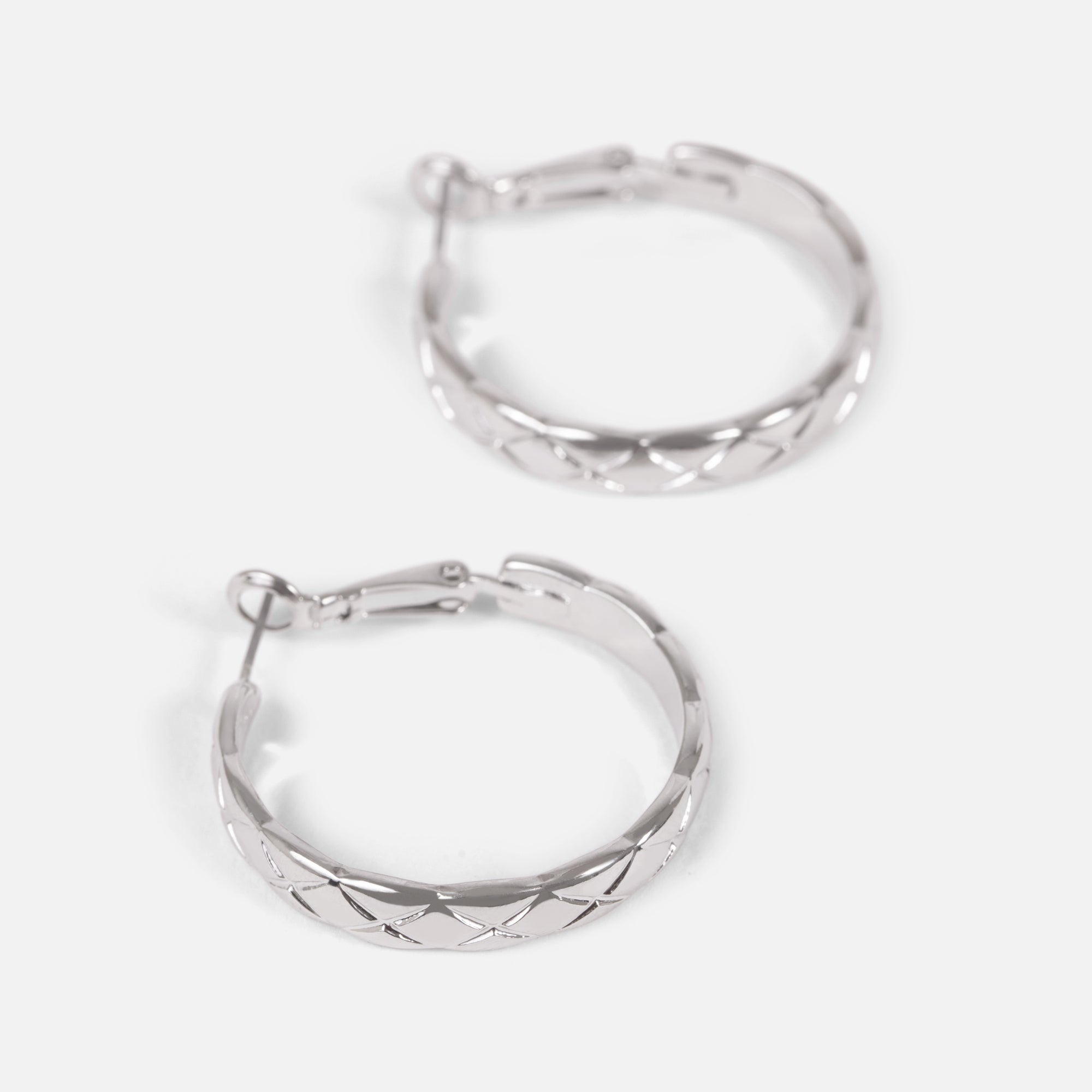 Silver hoop earrings with scale pattern