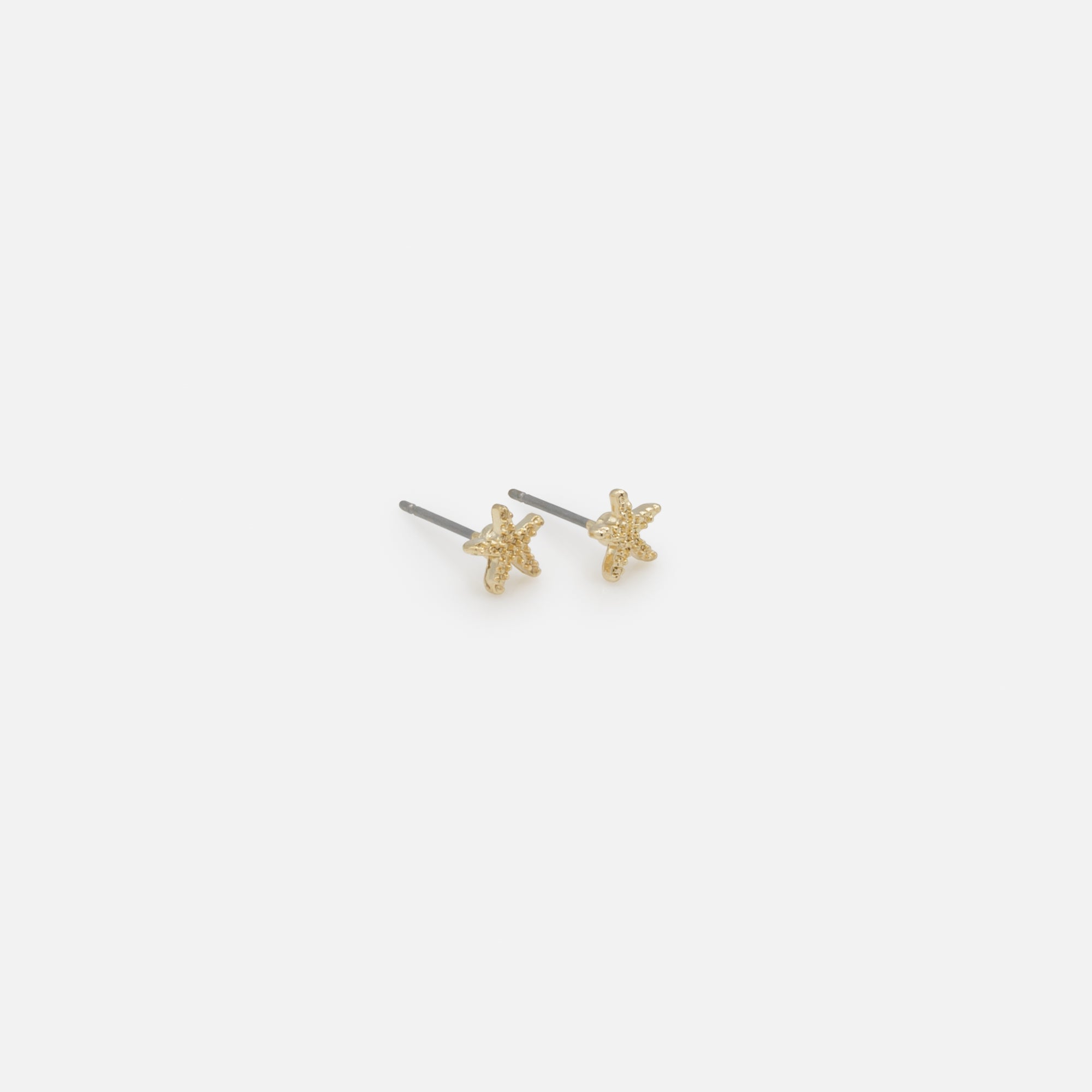 Trio of starfish pearl earrings and gold rings with pearly band