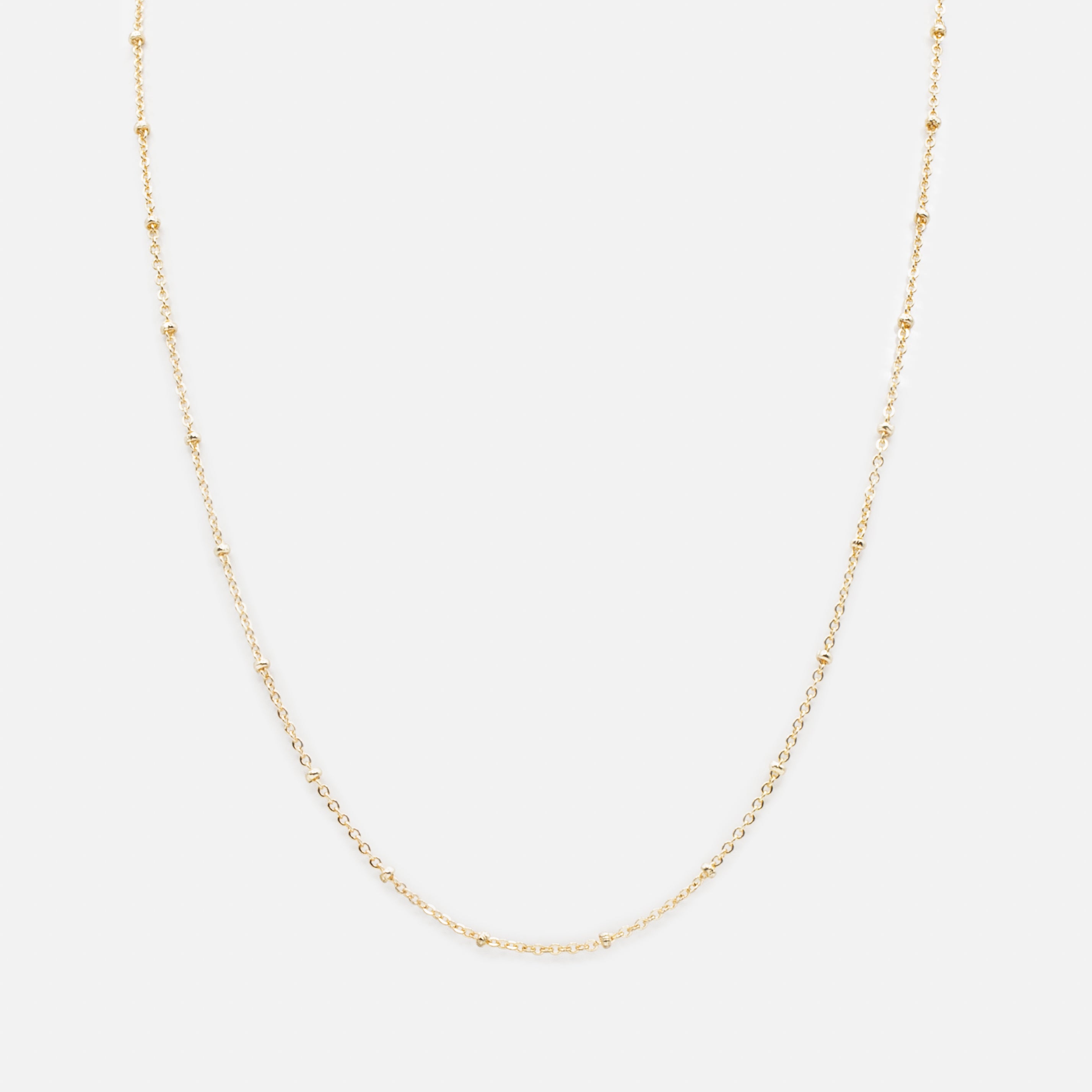 Ensemble de deux colliers dorés pendentif fleur en perles