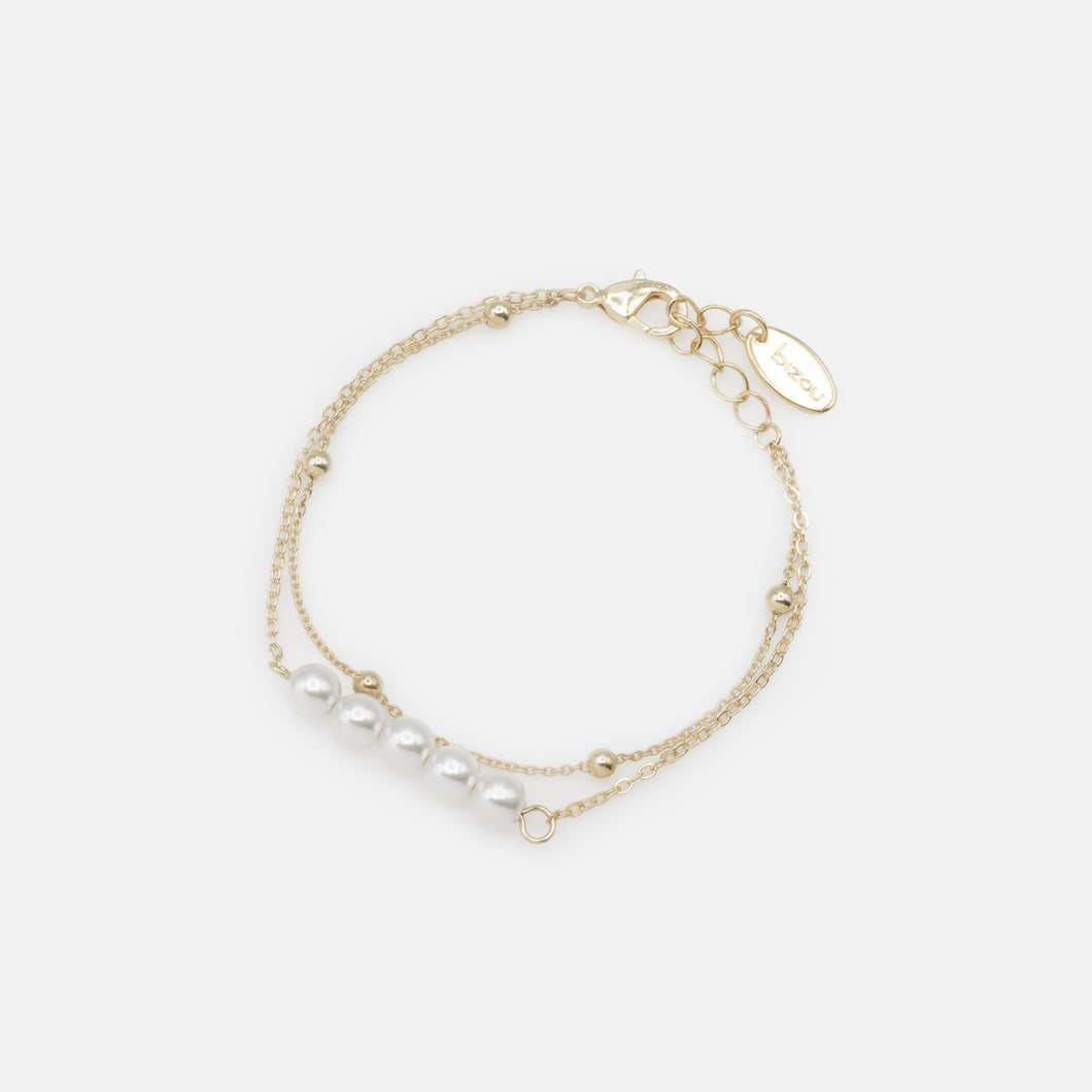 Golden bracelet with five pearls and double chain