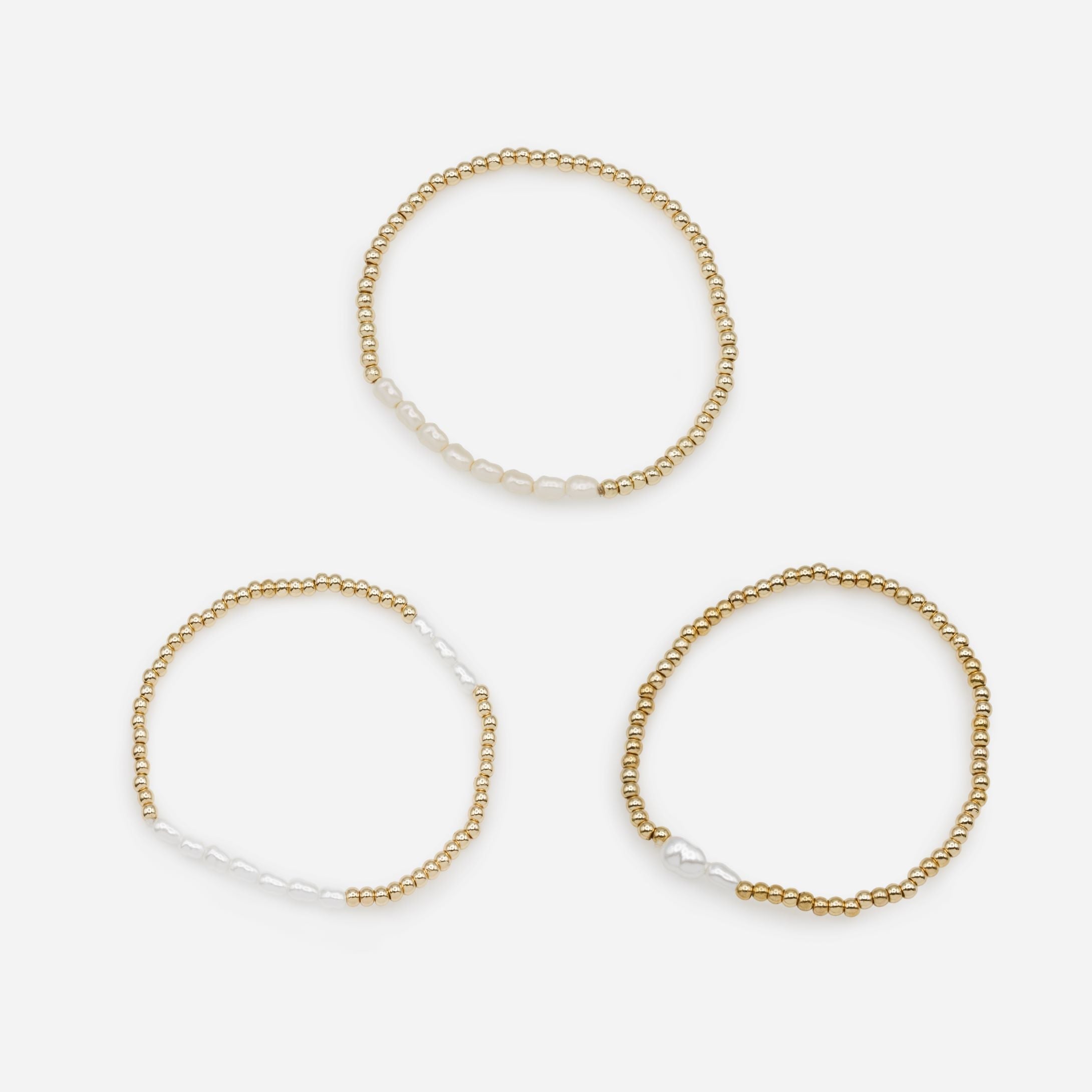 Trio of golden elastic bracelets with synthetic pearls, three ways to wear