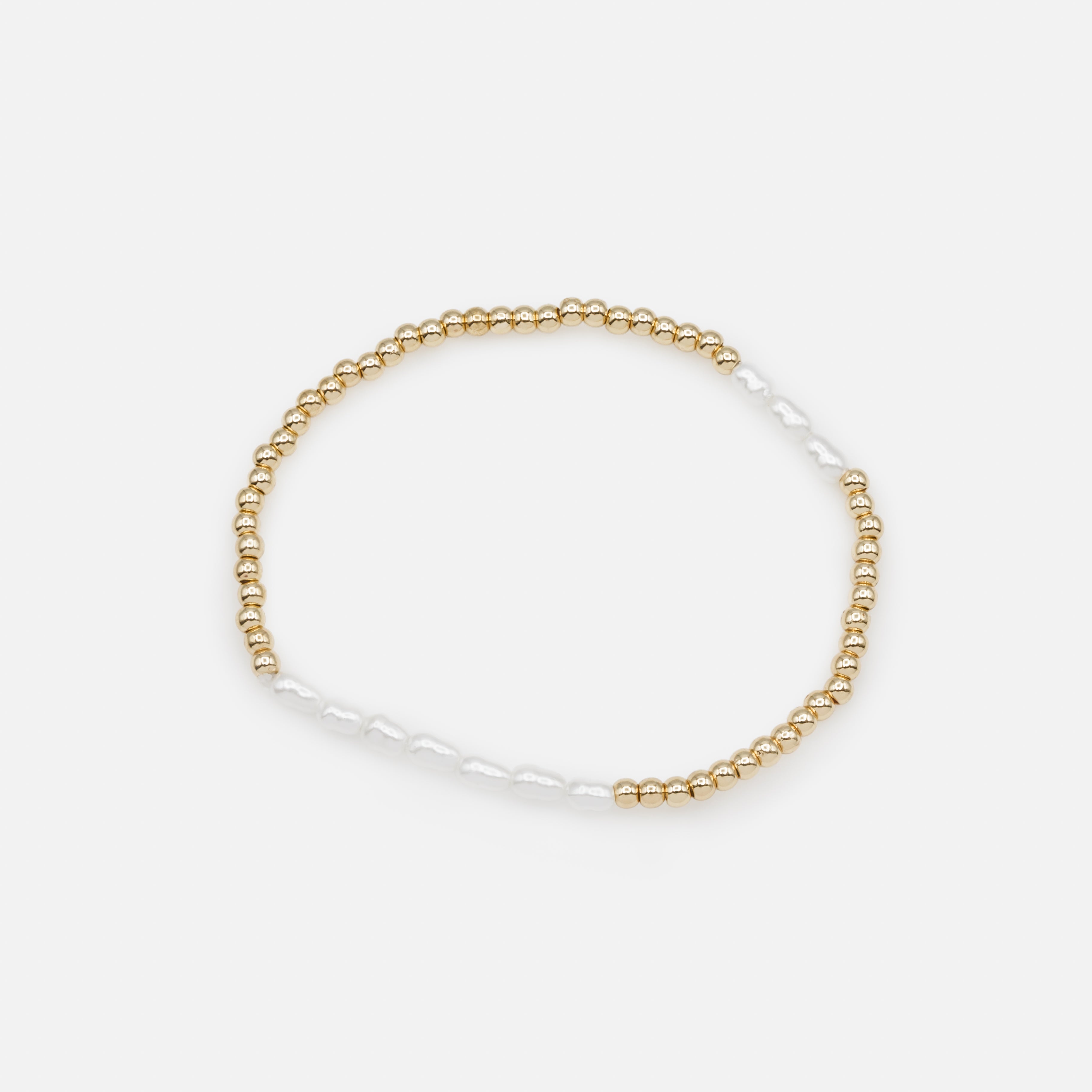 Trio of golden elastic bracelets with synthetic pearls, three ways to wear