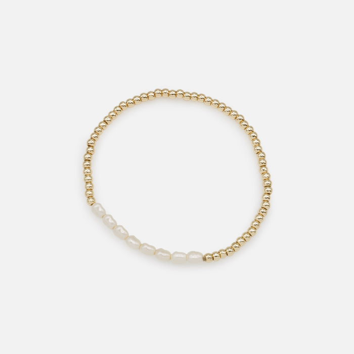 Trio of golden elastic bracelets with synthetic pearls, three ways to wear