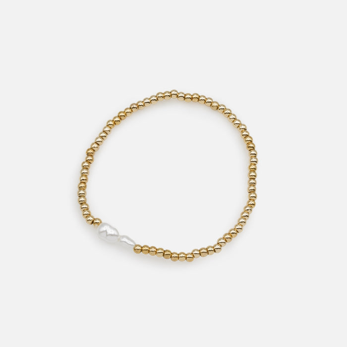 Trio of golden elastic bracelets with synthetic pearls, three ways to wear