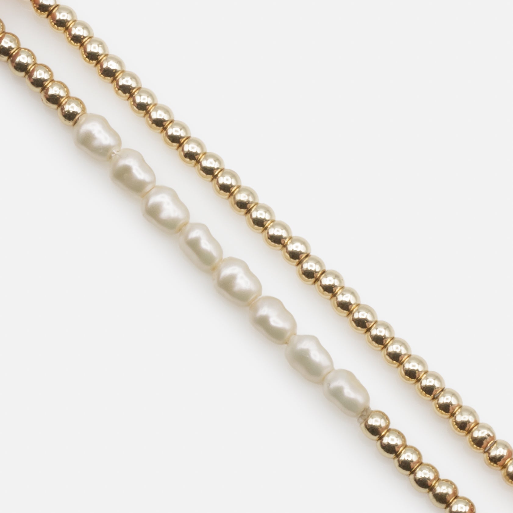 Trio of golden elastic bracelets with synthetic pearls, three ways to wear