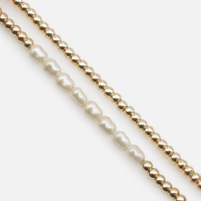 Trio of golden elastic bracelets with synthetic pearls, three ways to wear