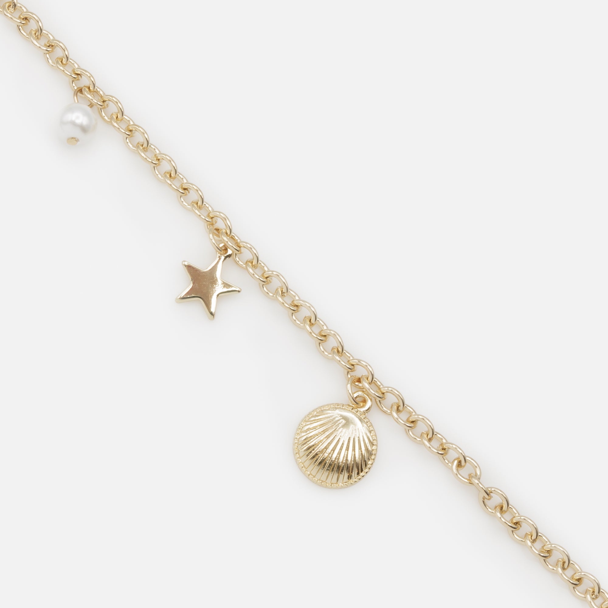 Golden bracelet with seaside charms