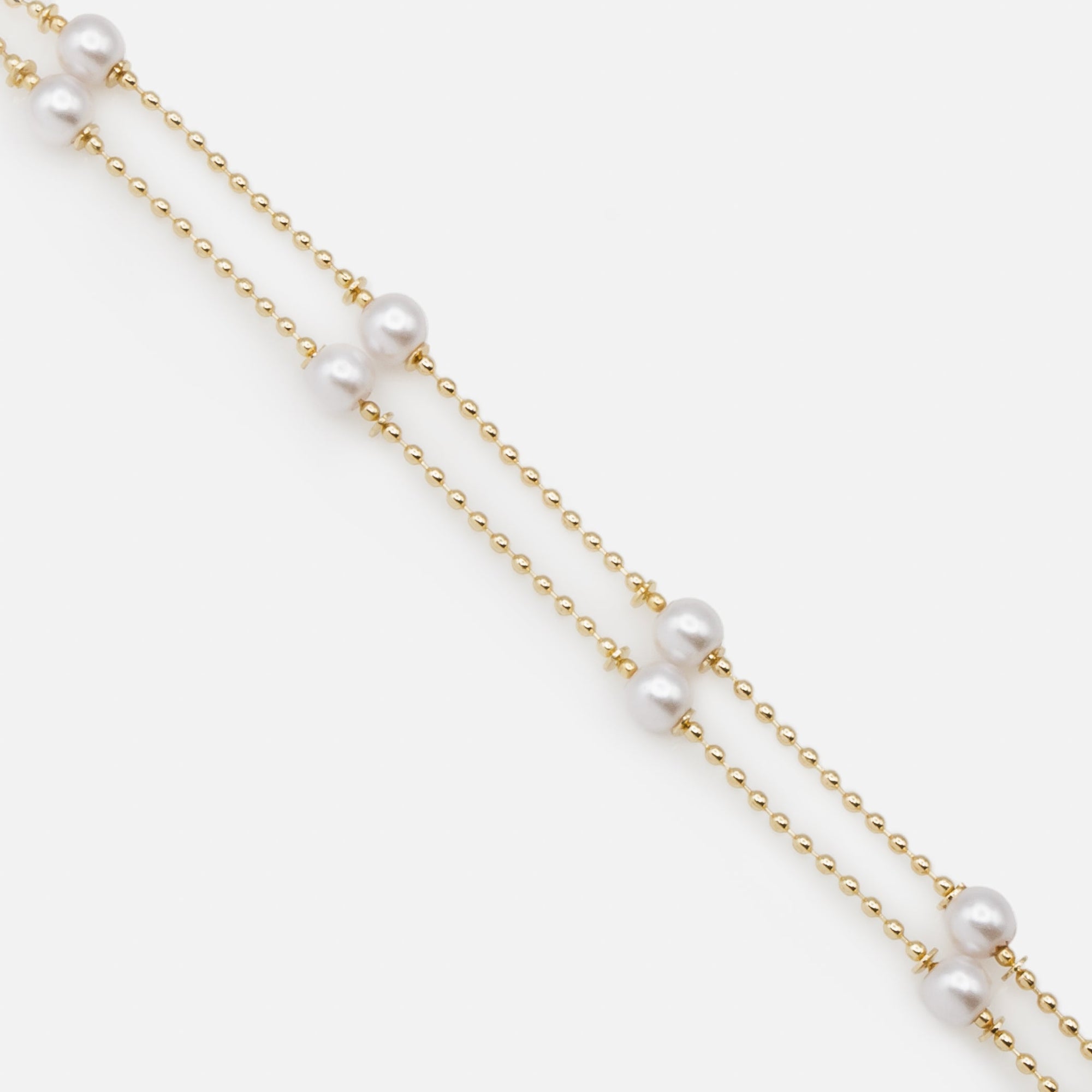 Double chain bracelet with fine gold beads and round pearls