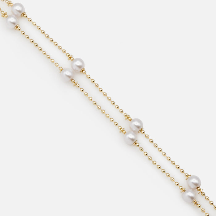Double chain bracelet with fine gold beads and round pearls
