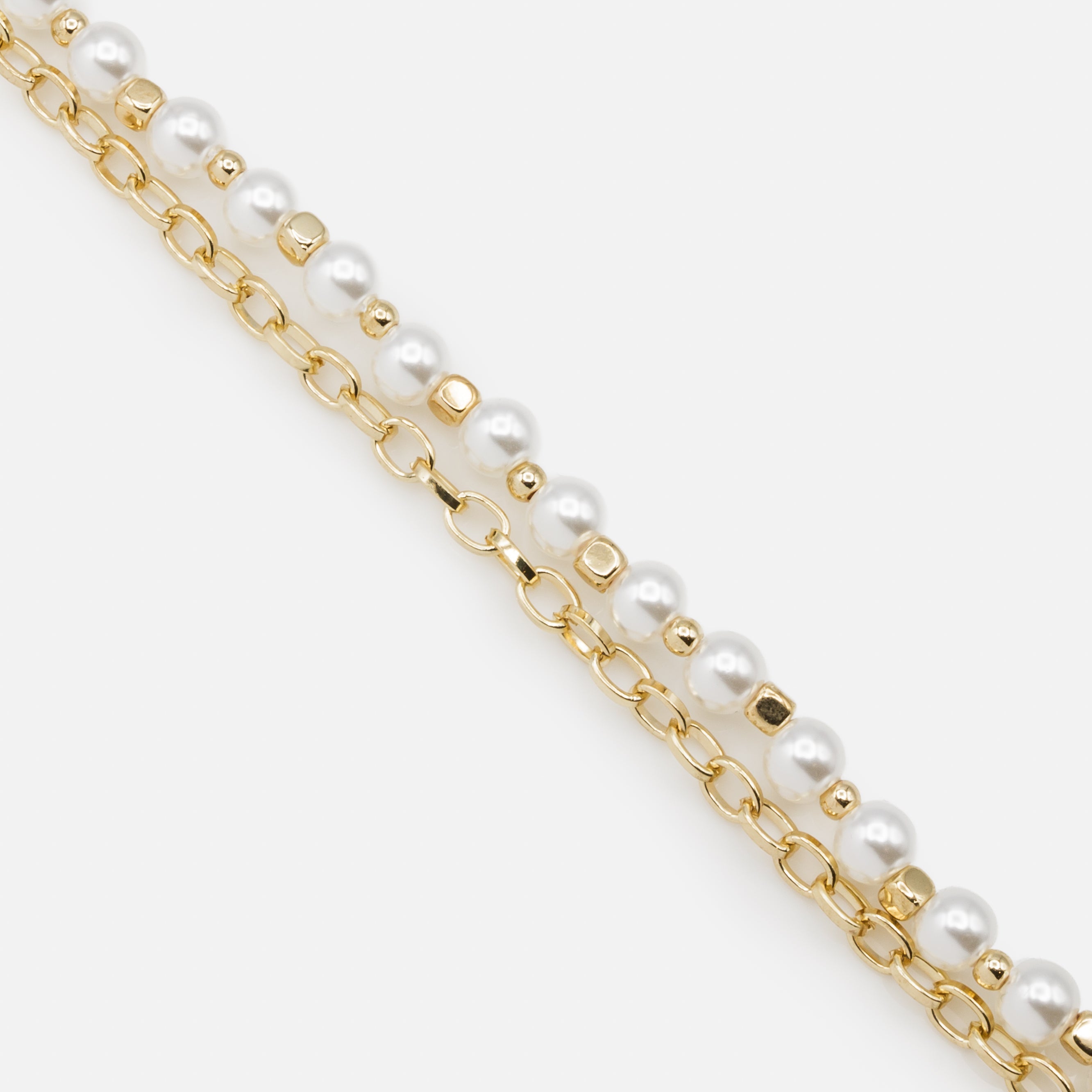 Gold double chain bracelet with synthetic pearls and cubic beads