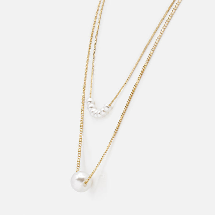 Gold double chain necklace with synthetic round pearls in two sizes