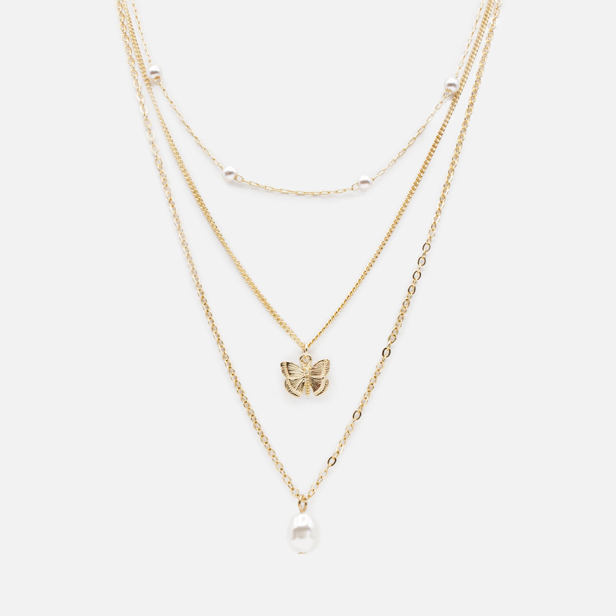 Gold triple chain necklace with pearls and butterfly pendant