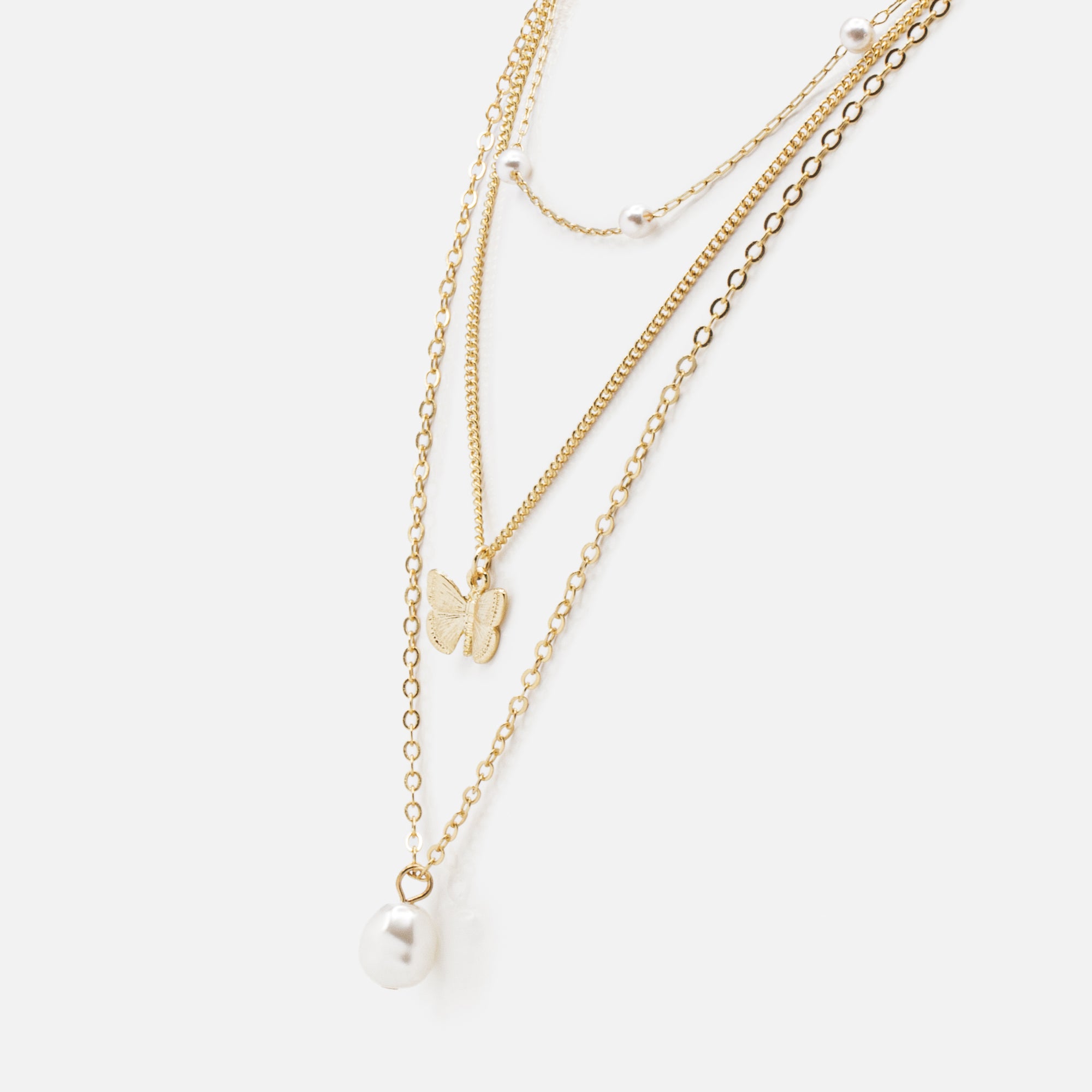 Gold triple chain necklace with pearls and butterfly pendant