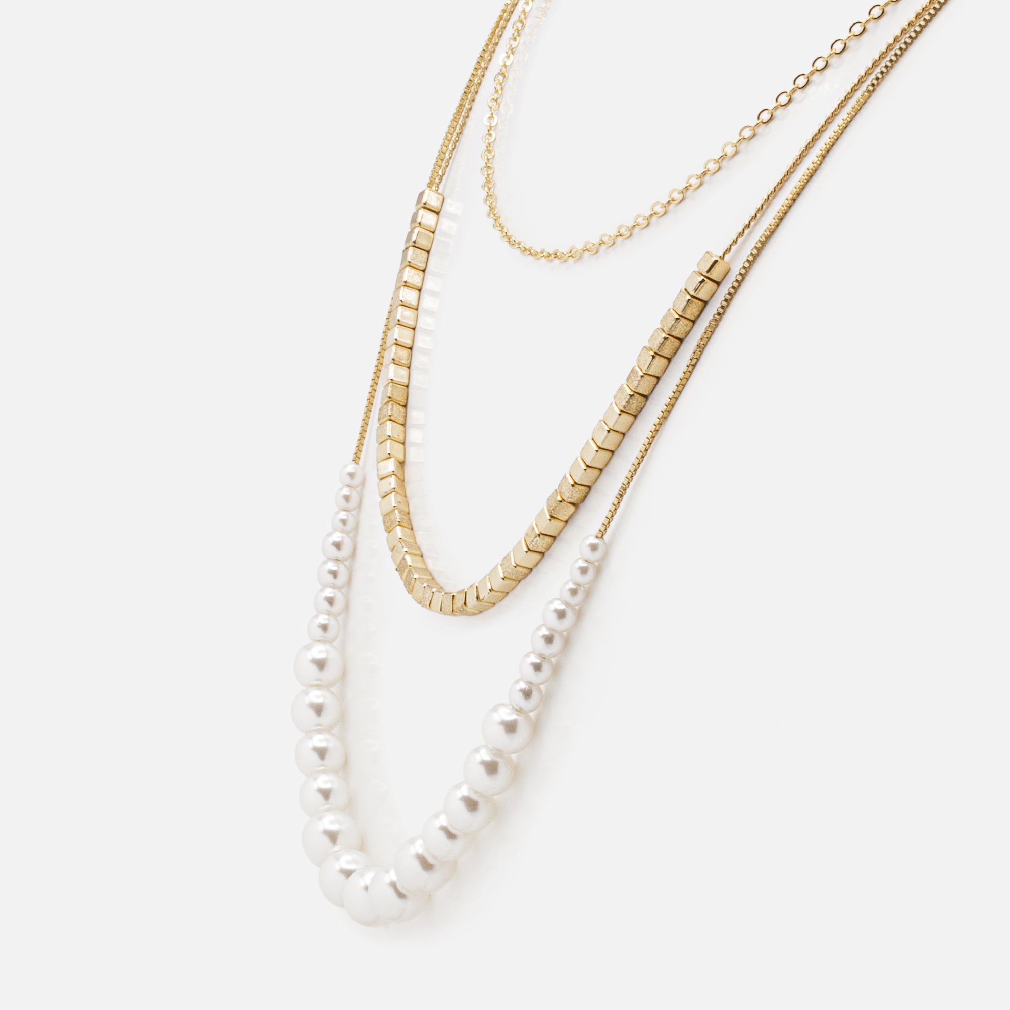 Golden triple chain necklace with cubed beads and pearl progression