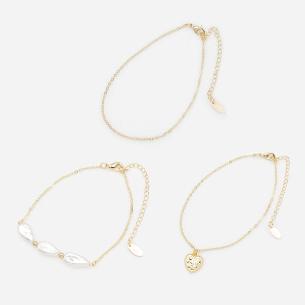 Load image into Gallery viewer, Trio of gold anklets with flat beads and textured heart
