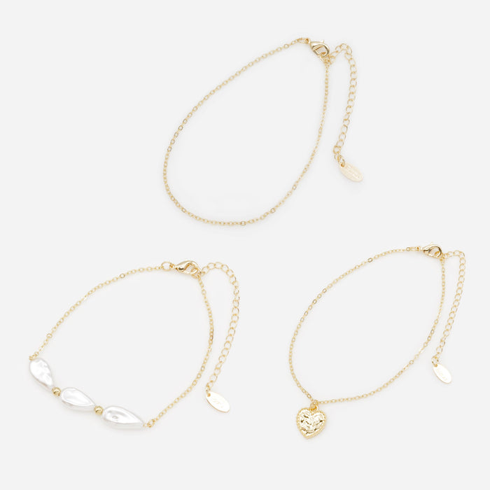 Trio de chaînes de cheville dorées avec perles plates et coeur texturé