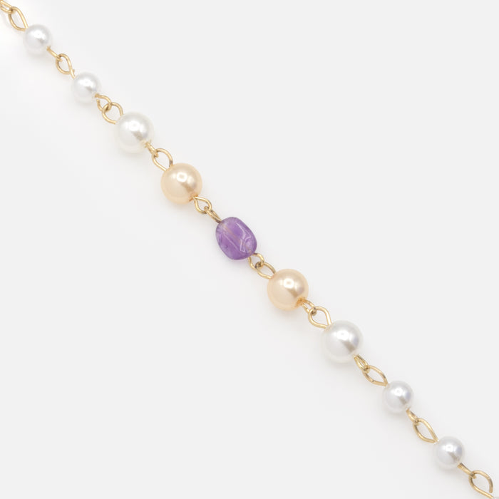 Bracelet doré perles deux tons et pierre mauve