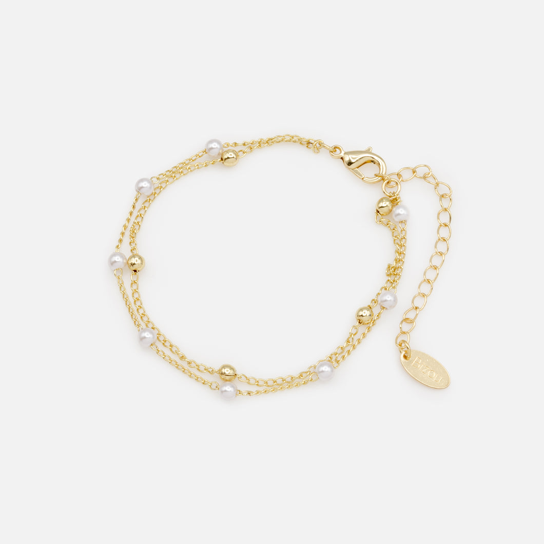 Gold double chain bracelet with delicate gold beads and beads