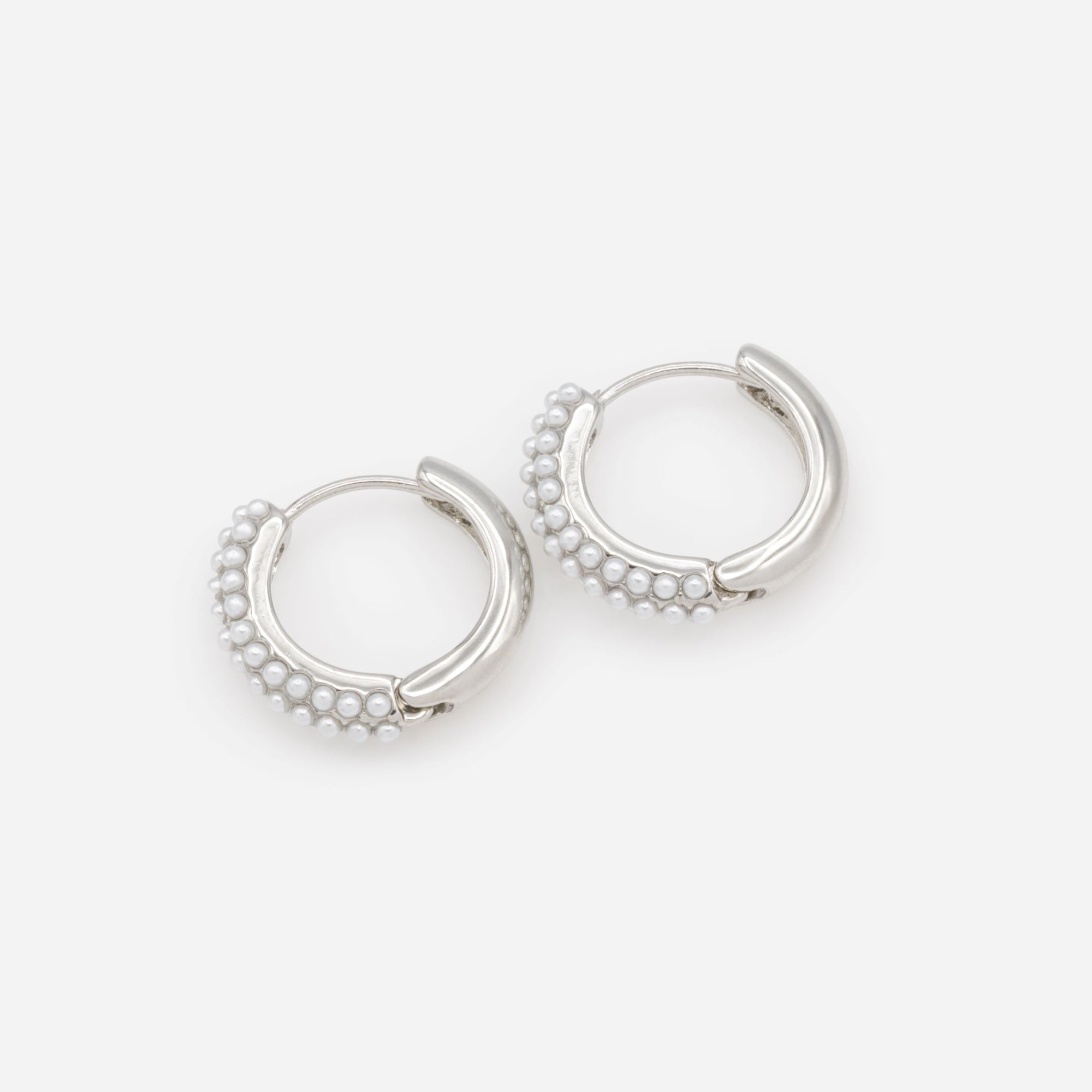 Silver hoop earrings with pearl surface