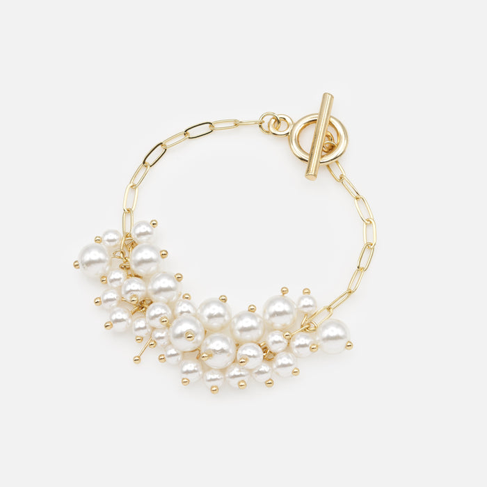 Golden bracelet with bouquets of synthetic pearls