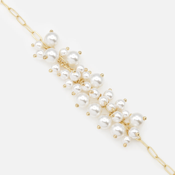 Golden bracelet with bouquets of synthetic pearls