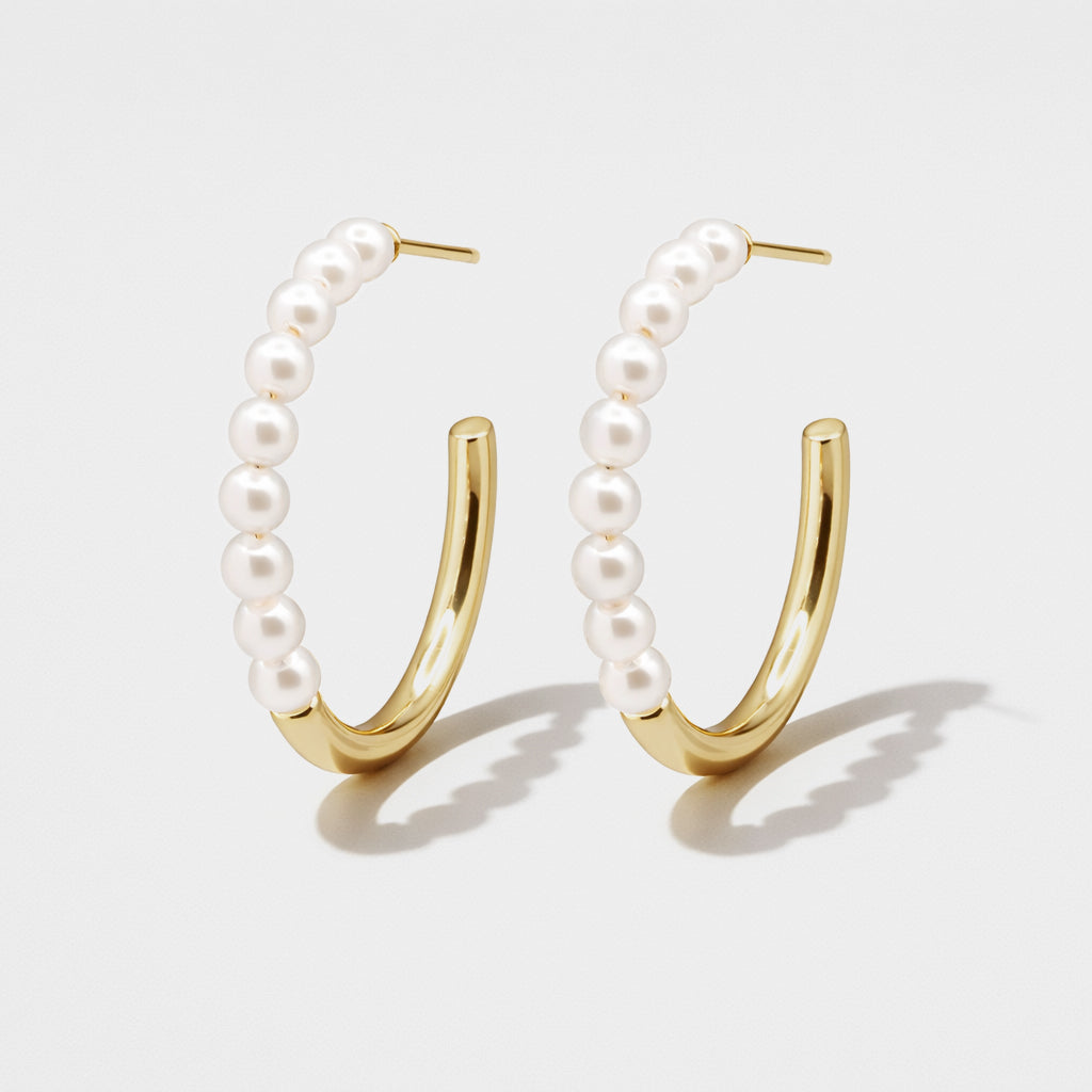 Gold hoop earrings with half synthetic pearls