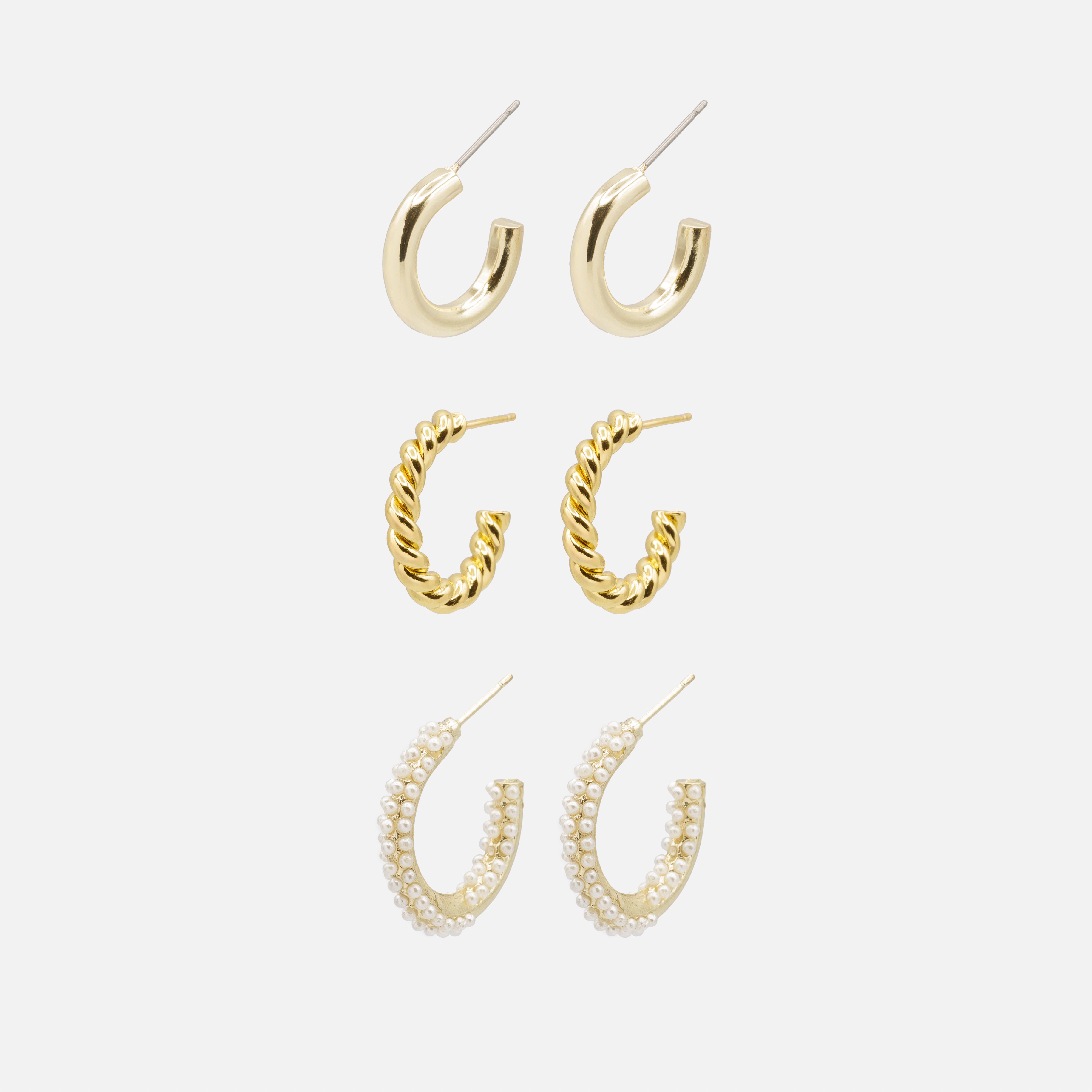 Trio of gold hoop earrings