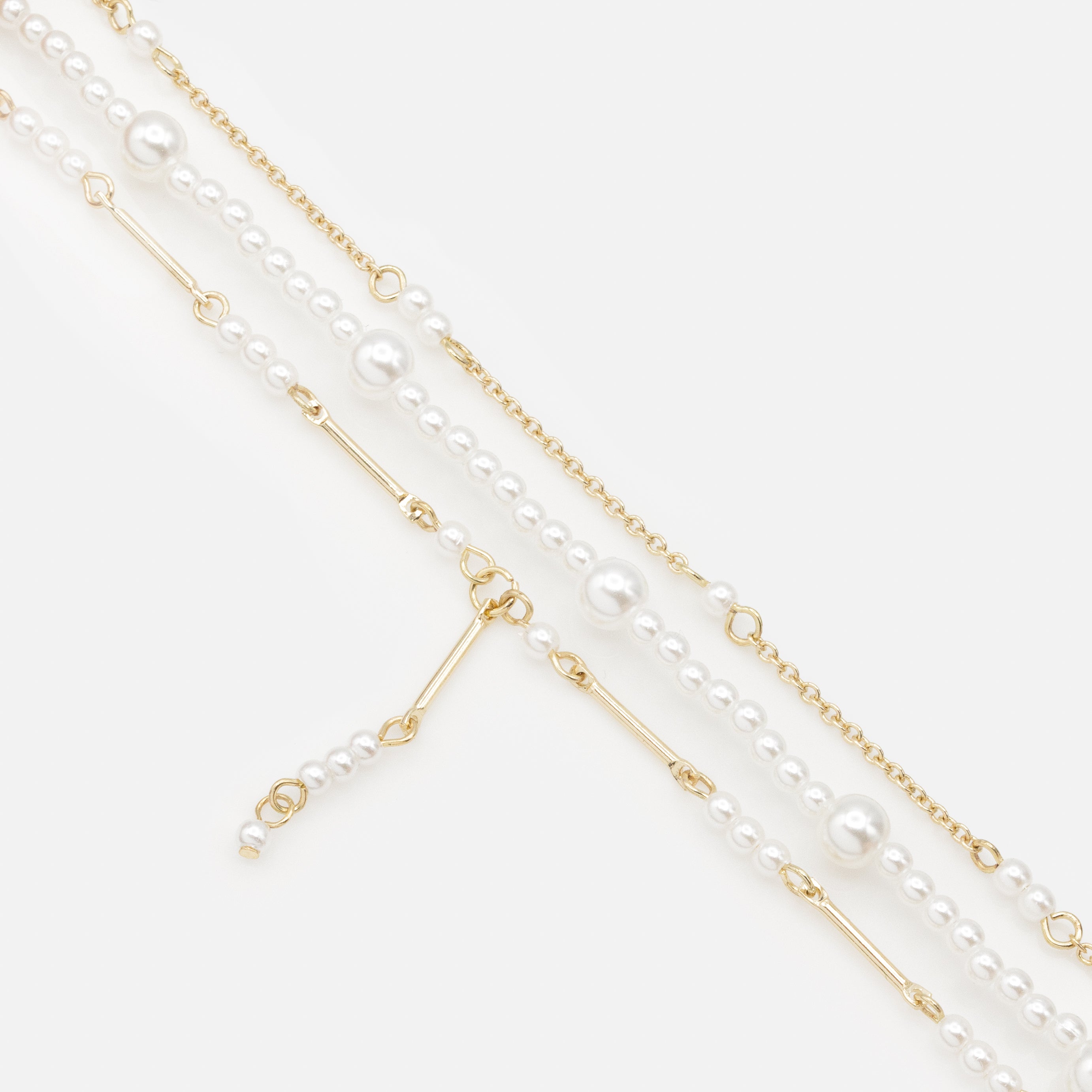 Trio de bracelets dorés avec perles