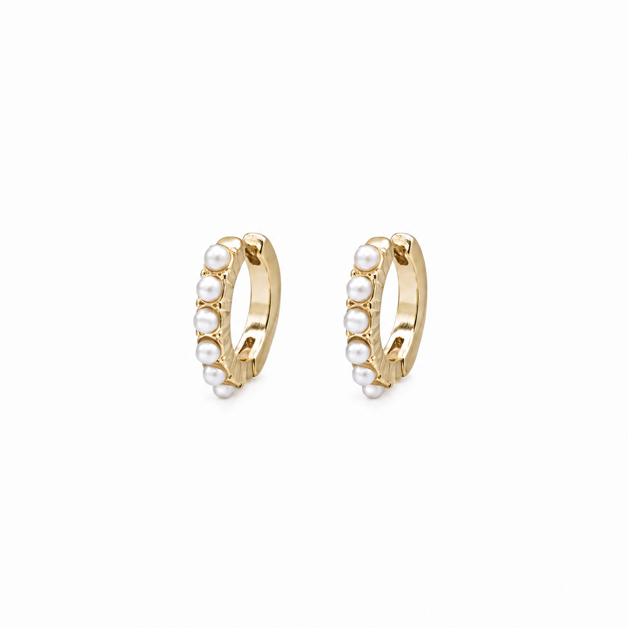 Textured gold huggie earrings with inlaid pearls