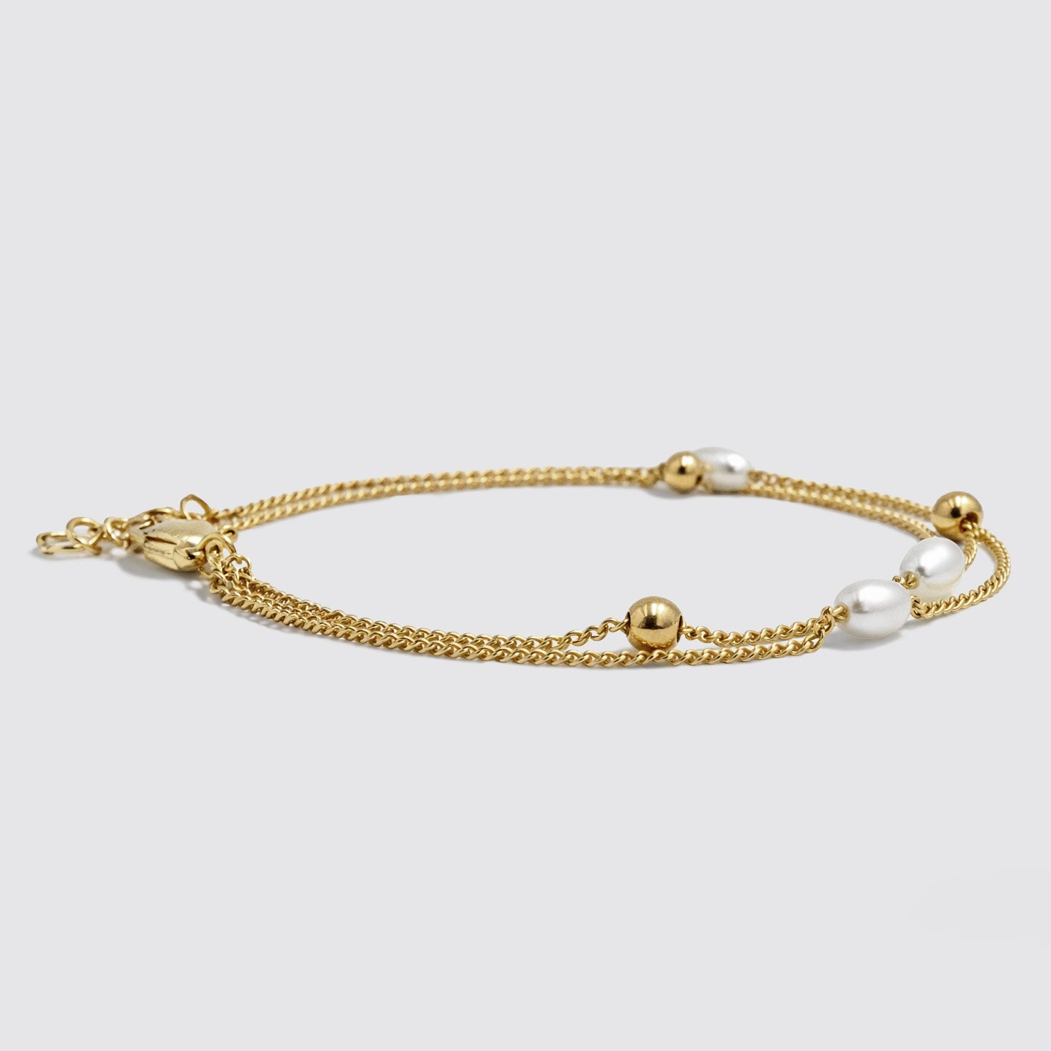 Bracelet double rang doré à perles et billes