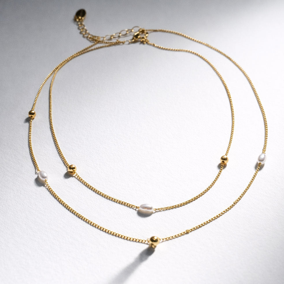 Collier double rang doré à perles et billes