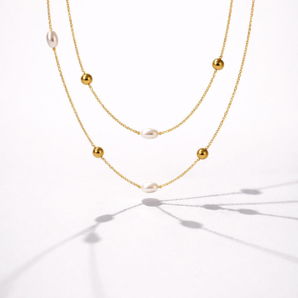 Collier double rang doré à perles et billes