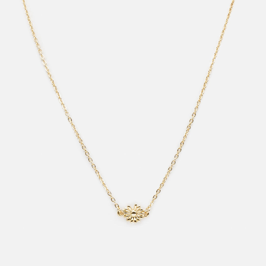 Golden necklace with small flower pendant