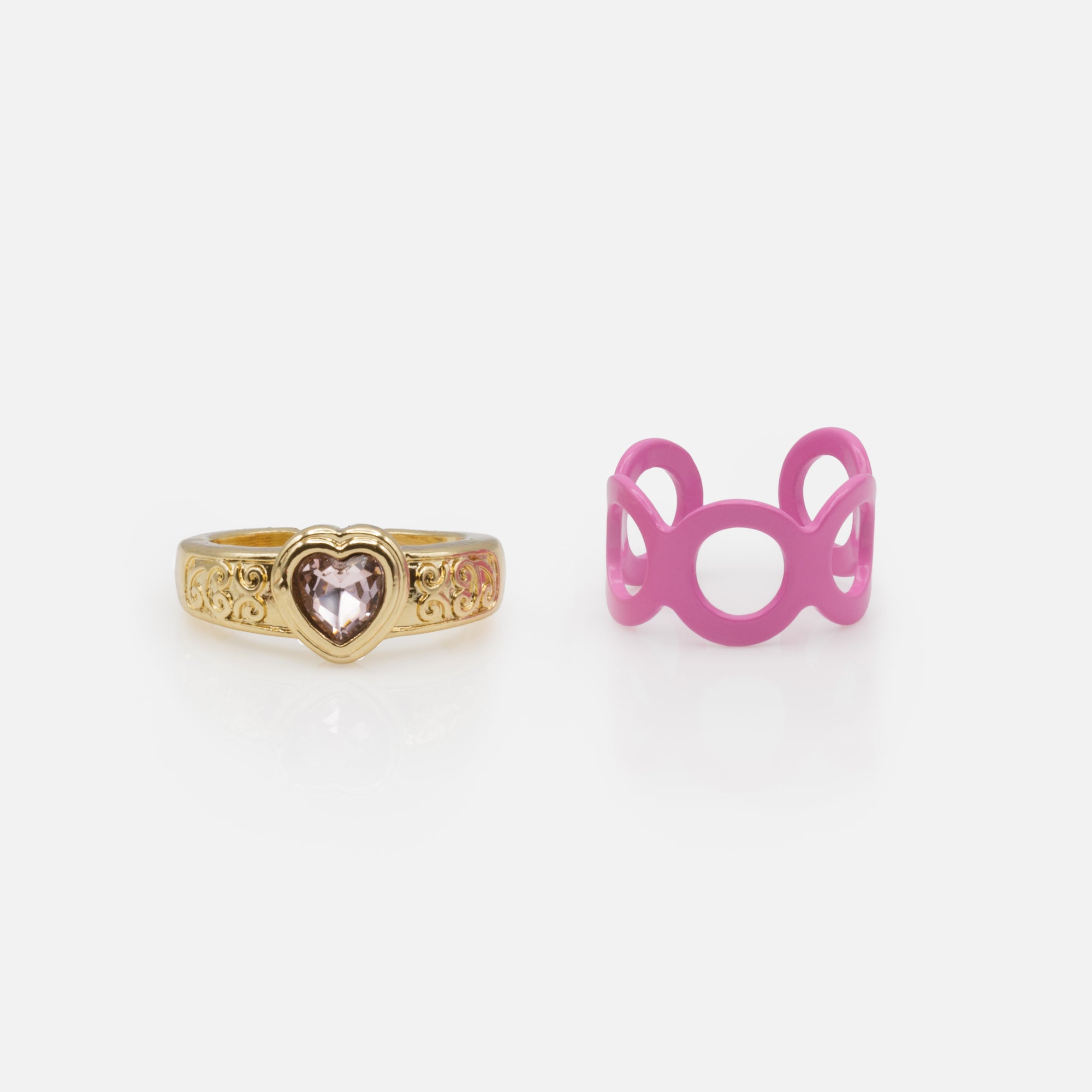 Set of two golden open rings with purple stone and pink serpentine