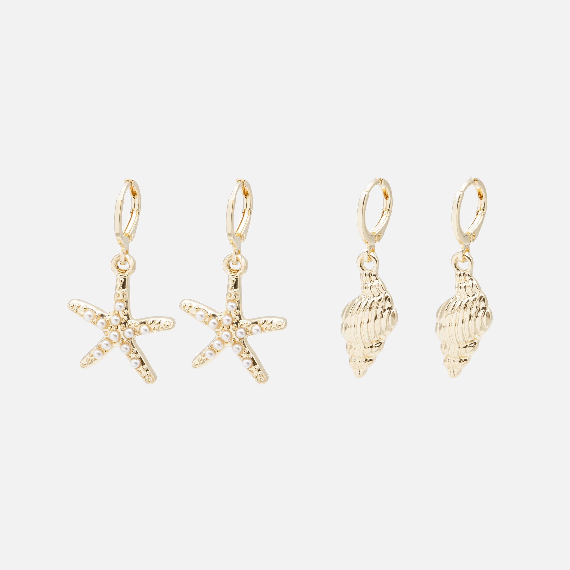 Duo of golden hoop earrings with sea charms