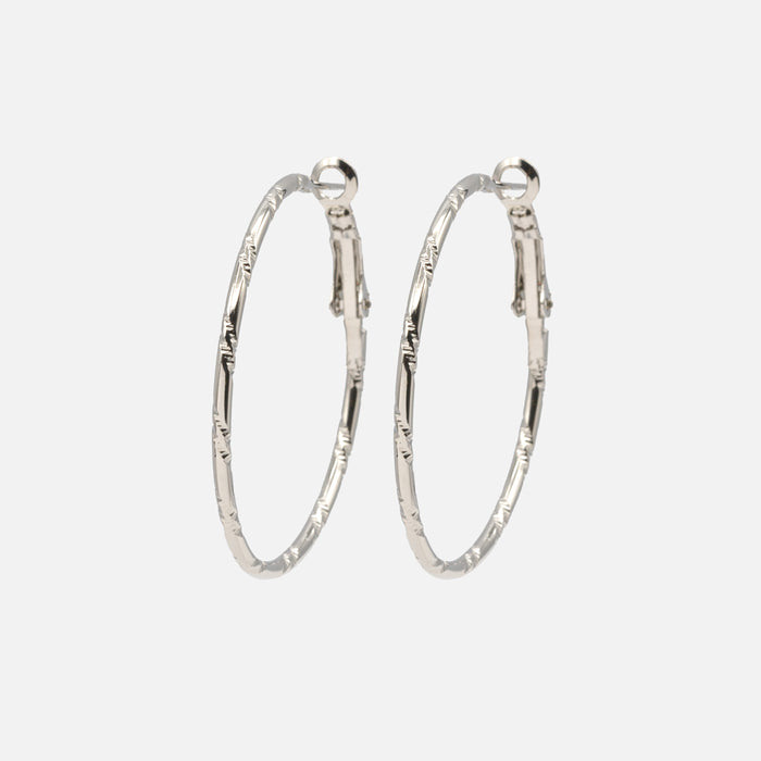 Boucles d'oreilles anneaux argentés à motifs