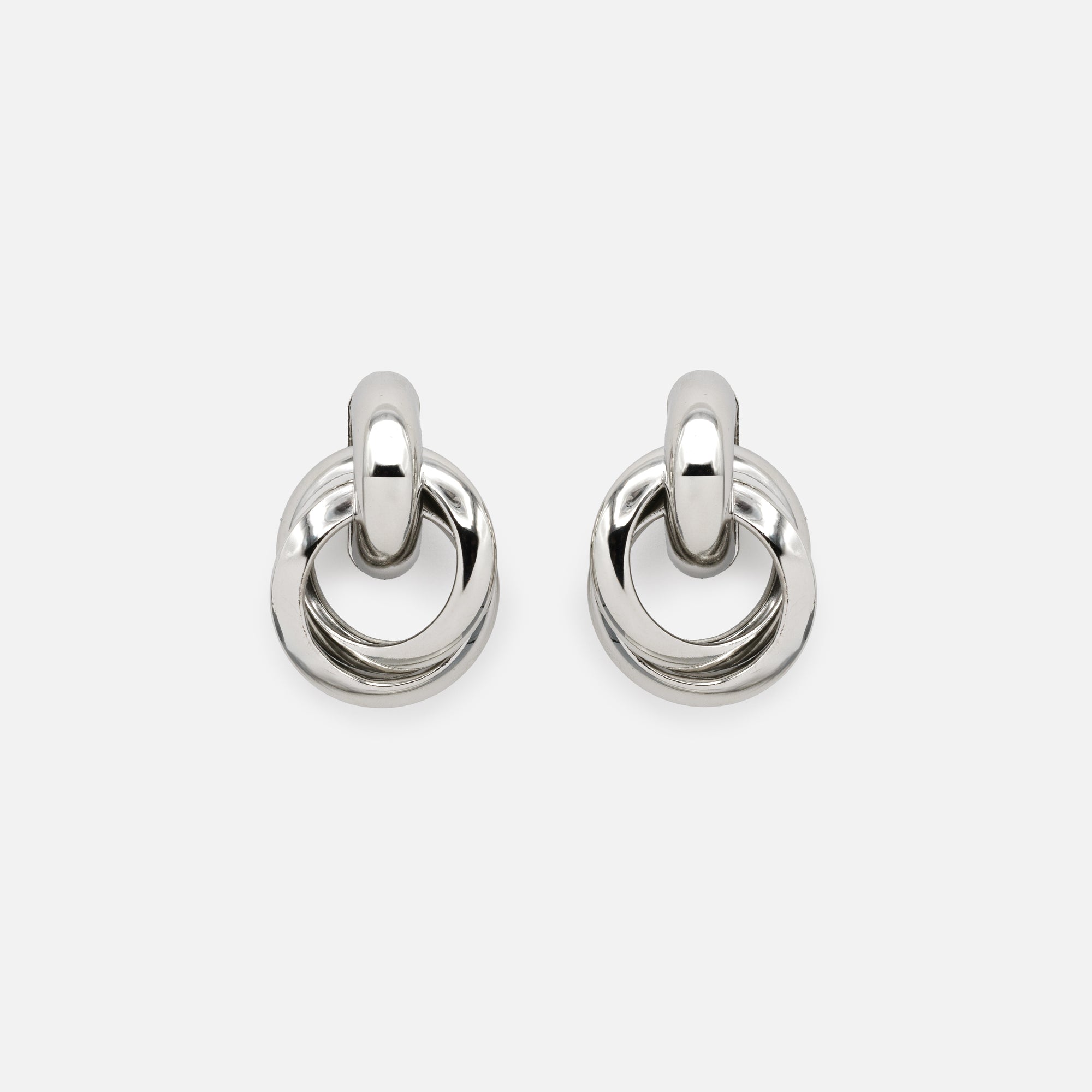 Silver fixed earrings with intertwined hanging rings