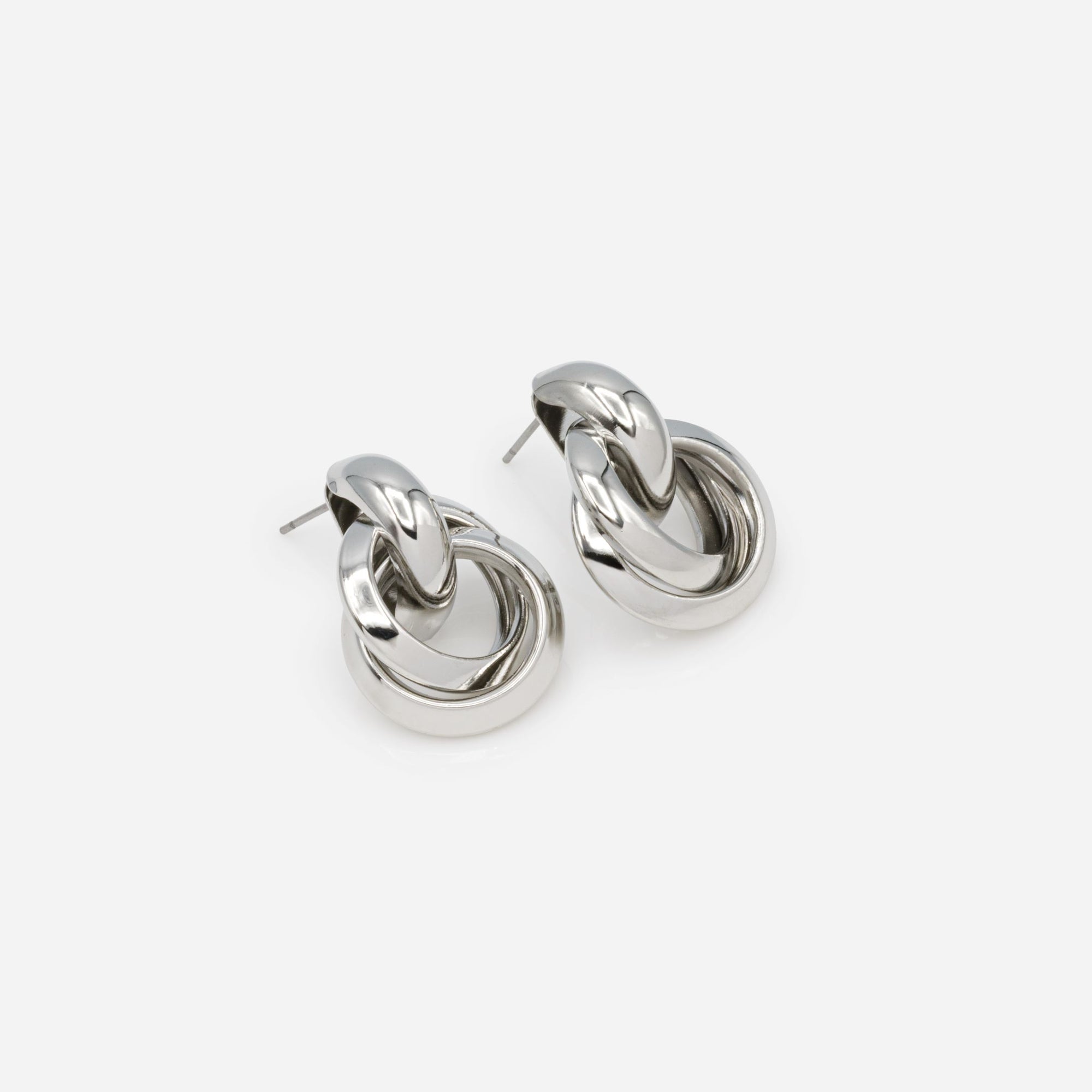 Silver fixed earrings with intertwined hanging rings