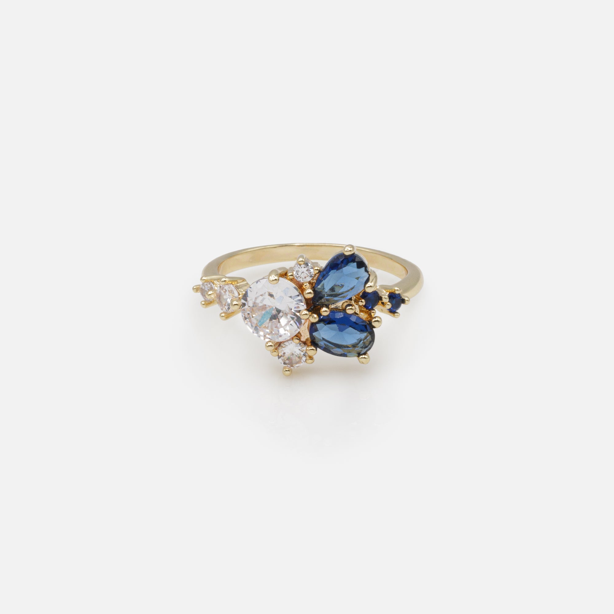 Golden ring blooming with navy and white stones