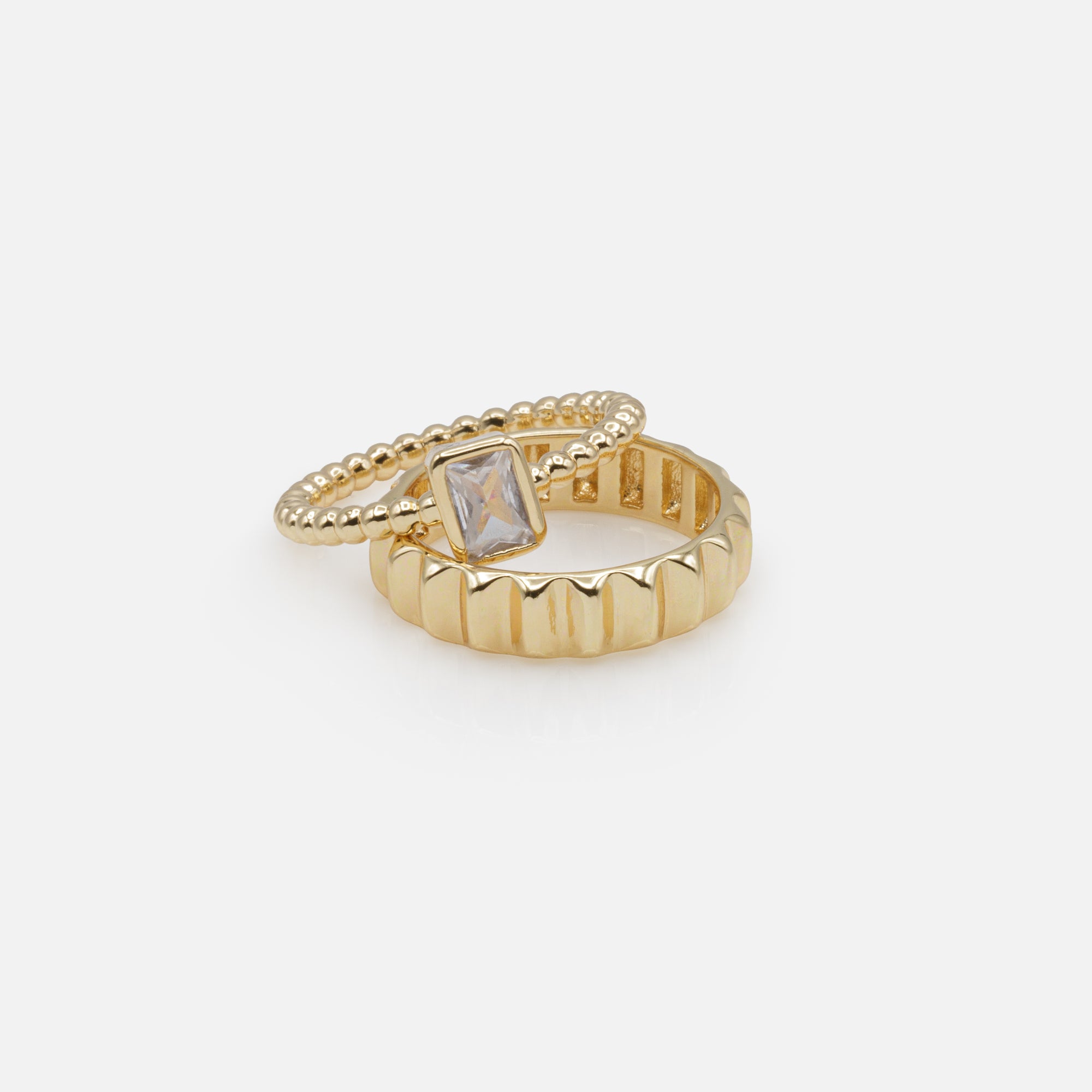 Duo of golden rings with rectangular stone and embossed ring