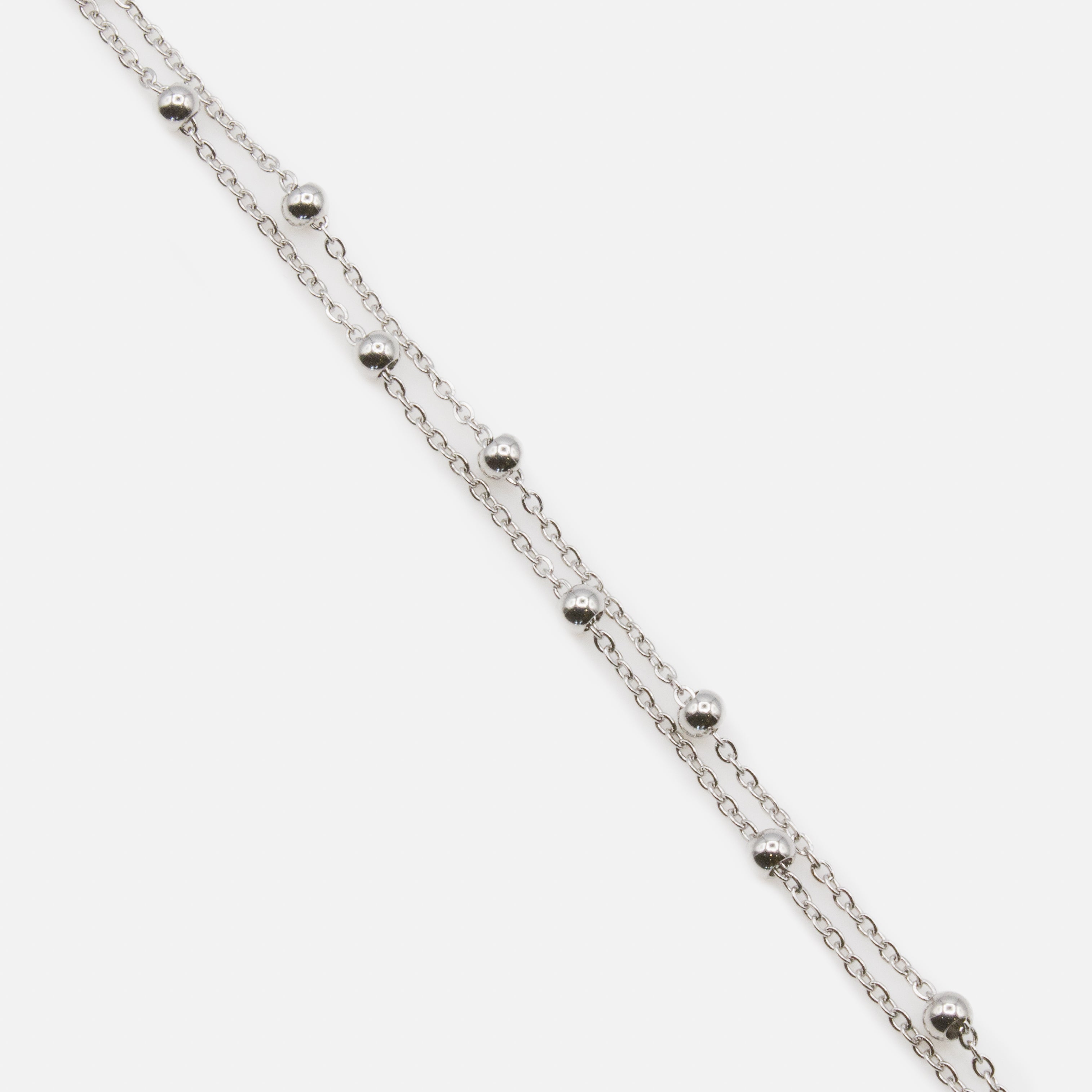 Silver double chain bracelet with forced links and beads