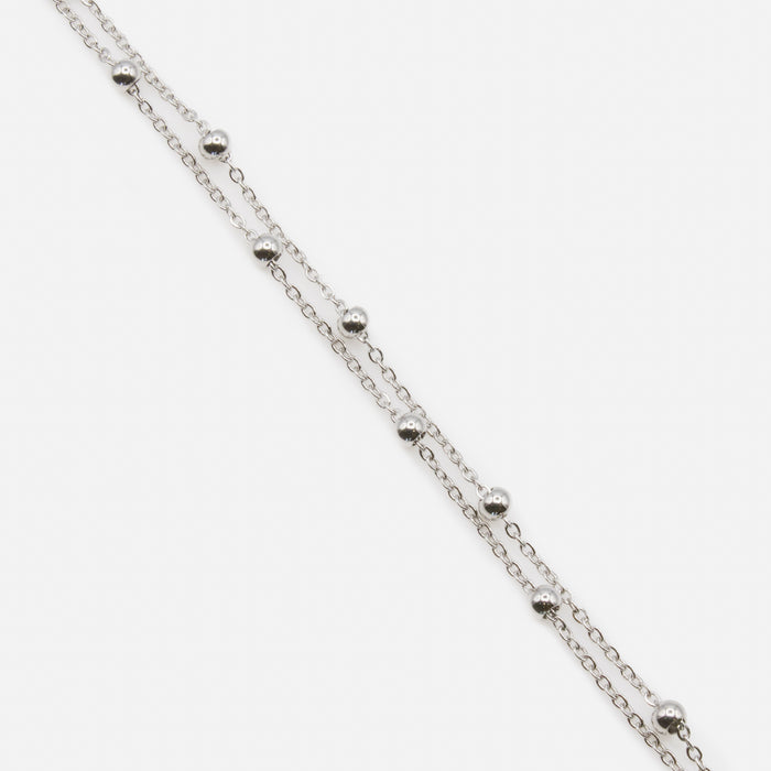 Silver double chain bracelet with forced links and beads