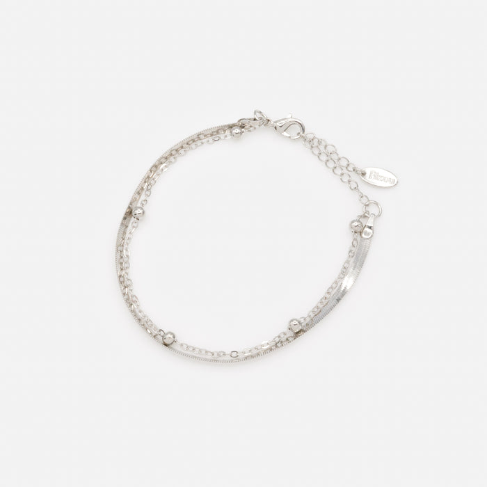 Silver double chain bracelet with flat and forced links and beads