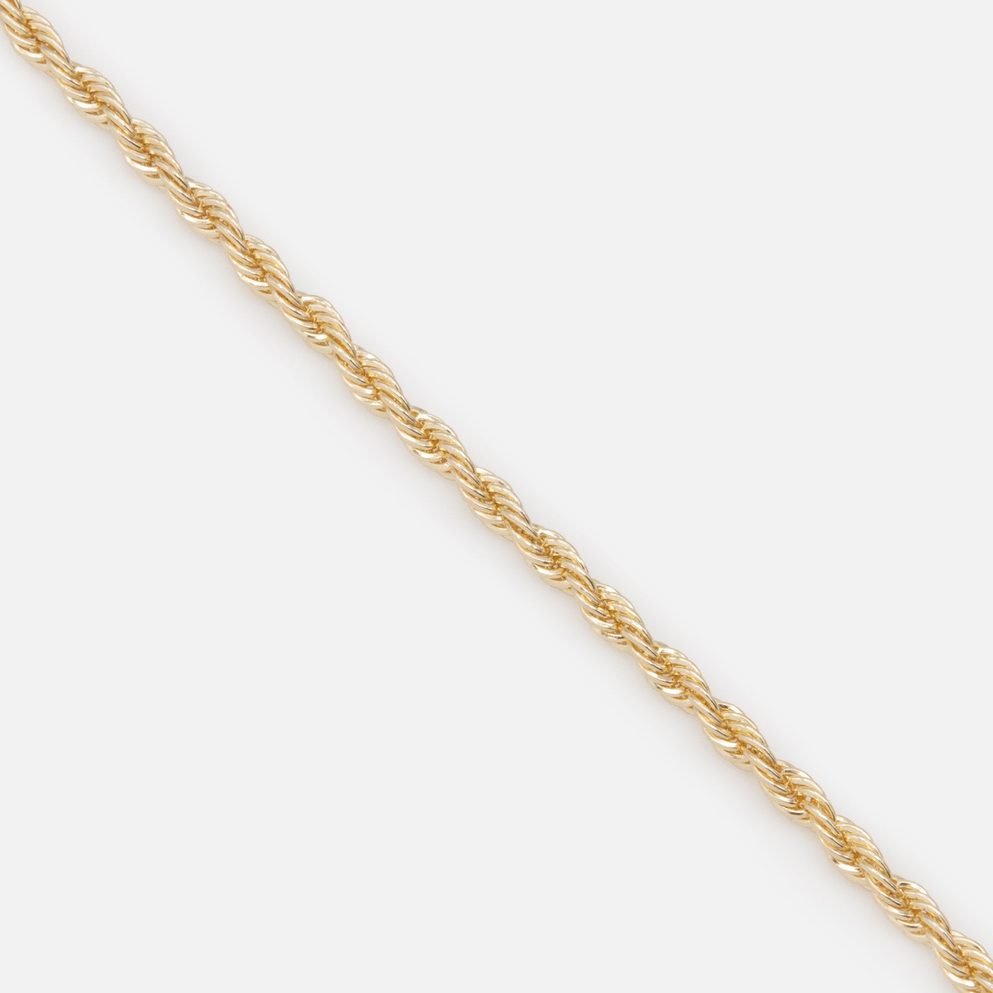 Trio of gold bracelets with flat and twisted links