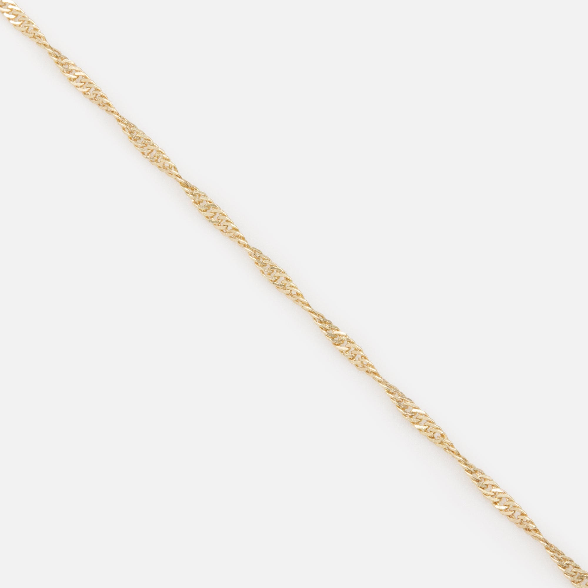 Trio of gold bracelets with flat and twisted links